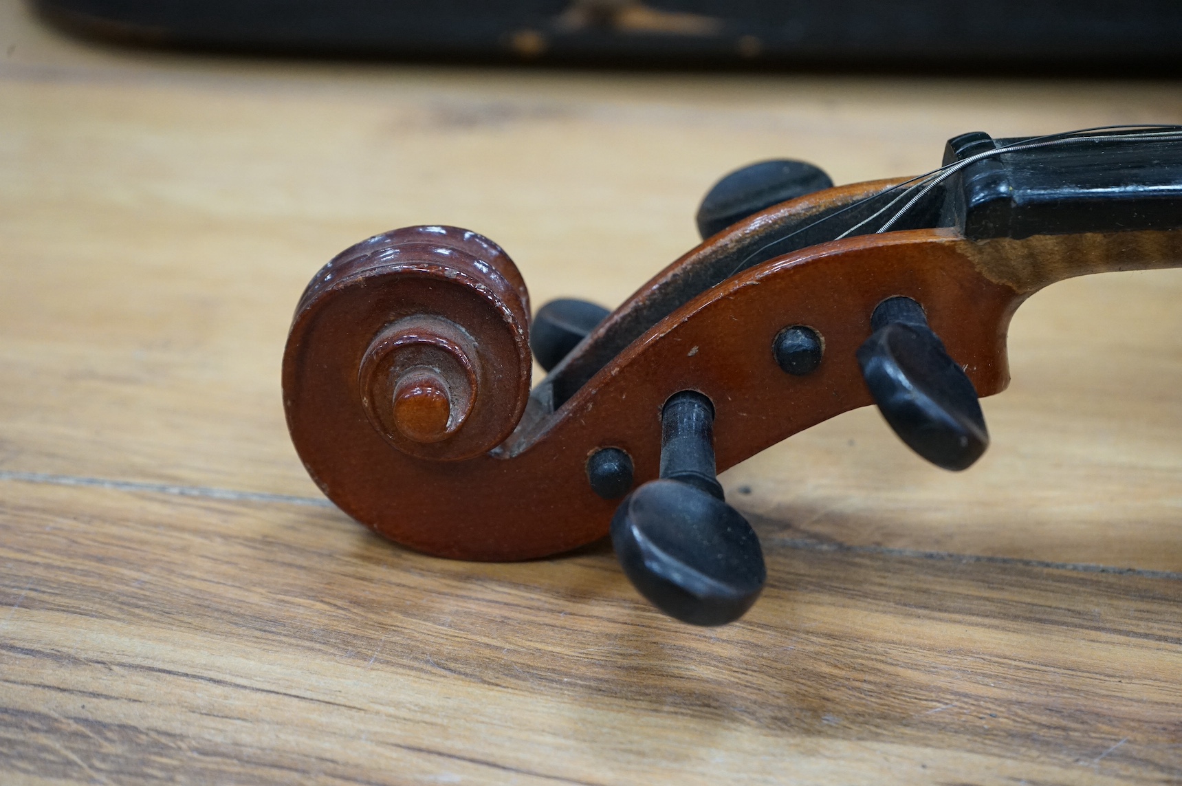 An early 20th century violin, possibly Czech, with internal label for ‘Maidstone Orchestra Association, Oxford St. London’ and bow, in case, length of back of body, 36cm., Condition - fair to good.